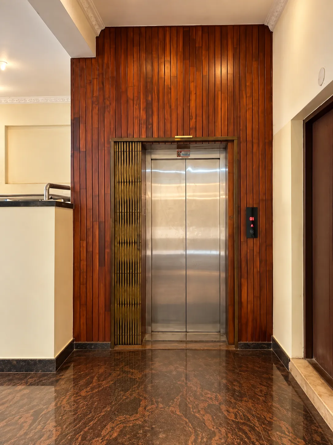 Warm Symmetrical Wood Paneled Elevator Lobby